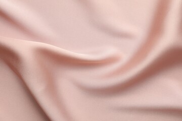 Crumpled pink silk fabric as background, top view