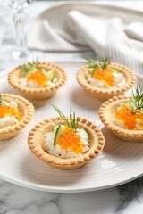 Delicious canapes with red caviar on white marble table