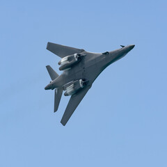 B-1 jet under belly with water vapor cloud