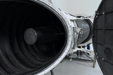 Powerful closeup of a jet engine with exhaust pipe, showcasing the intricate mechanics and...