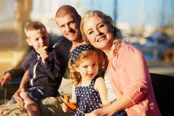 Portrait, love and family at dock with happiness for ocean holiday adventure and support for relationship. Man, woman and children with smile for sea travel and summer vacation together in Florida