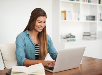 Smile, laptop and woman in home office at desk for work or freelance agency browsing on the internet. Study, career and promotion test in journalism company with practice on website in apartment.