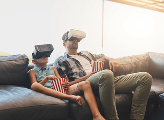 Virtual reality, father and girl on sofa with popcorn for futuristic, streaming movies or...