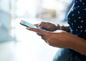 Business woman, hands and typing with phone for social media, communication or browsing at office. Closeup of female person or employee on mobile smartphone for online chatting, texting or research