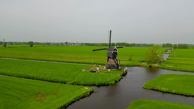 Areal view of Oude Weteringmolen, is a historic wind mill located near Streefkerk in the Netherlands.