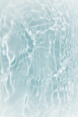 Blue water with ripples on the surface. Defocus blurred transparent blue colored clear calm water surface texture with splashes and bubbles. Water waves with shining pattern texture background.	