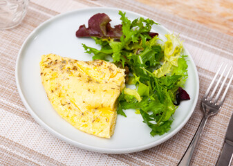 National French dish is an omelet made from lightly beaten eggs with milk and herbs in a frying pan