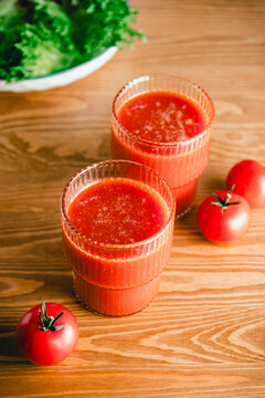Two glasses of fresh tomato juice on a table
