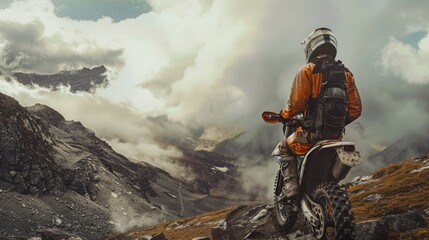 A man riding a dirt bike on top of a mountain