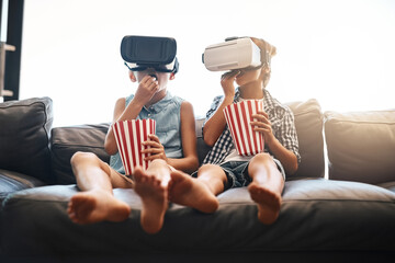 Children, popcorn and virtual reality headset in home of cyber experience, metaverse system or gaming connection. .Siblings, VR and movie in living room for future, digital world and ui video tech