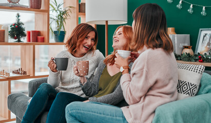 Christmas, group and friends with coffee, laughing or happy in vacation of festive season and...