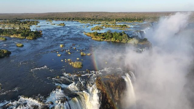 Famous Falls At Victoria Falls In Matabeleland North Zimbabwe. Giant Waterfalls. Nature Landscape. Victoria Falls At Matabeleland North Zimbabwe. Zambezi River. Travel Scenery.
