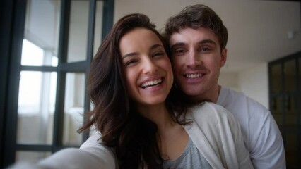 Webcam view influencer video record distant conference call vlog talking excited happy family couple Caucasian woman man guy male girl female parents showing USD picture pregnant baby ultrasound photo - Powered by Adobe