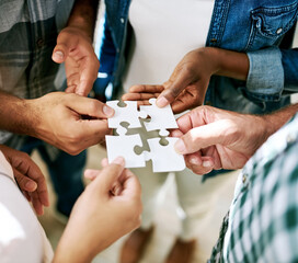 Hands, group and jigsaw for connection, solution and circle with collaboration for creativity at...
