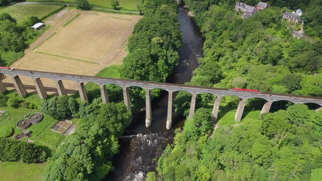Aerial view of Pontcysyllte Aqueduct in Wales, World Heritage Site with canal boat going across