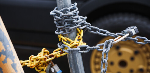 chain fence with blurred background, representing confinement and restriction