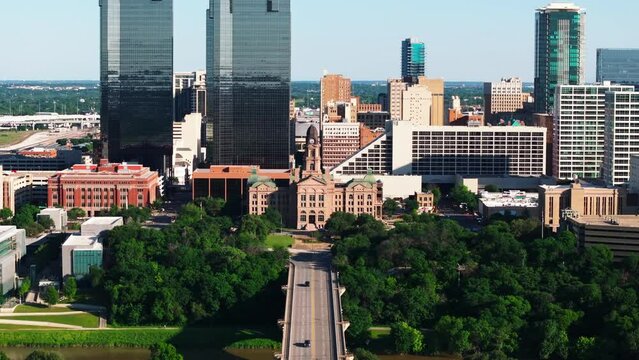 Aerial view of downtown Fort Worth, Texas, featuring modern skyscrapers, Tarrant County Court, road traffic and greenery