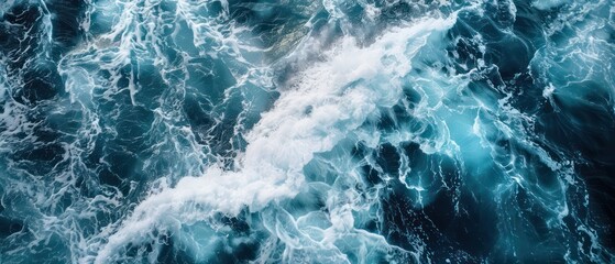 Fototapeta premium Sea water waves ripple under a clear blue sky, creating a peaceful and picturesque coastal view