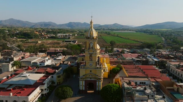 Tamazula de Gordiano, Jalisco, Mexico - The Tamazula Church Nestled Amidst Residential Neighborhoods - Orbit Drone Shot