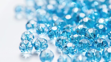 Sparkling Light Blue Glass Beads on White Background for Creating DIY Jewelry