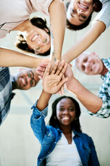 Business people, portrait and hands stack with low angle, teamwork and connection in huddle with...