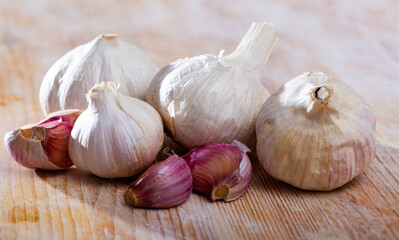 Image of fresh garlic on wooden background, nobody