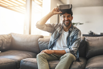 Obraz premium Portriat, man and virtual reality headset in home lounge of cyber experience, metaverse system or gaming connection. Happy gamer, VR or games in living room with future, innovation and ui technology