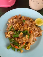 Pad Thai on a plate placed on the table. Thai food, Street food.