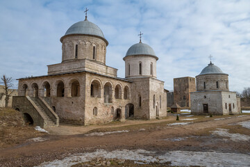 Church of the Assumption of the Blessed Virgin Mary and the Church of St. Nicholas in the Ivangorod fortress on a March day. Leningrad region, Russia