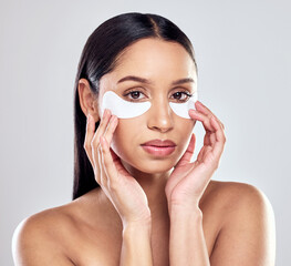 Skincare, portrait and woman in studio with eye mask, cosmetics or wellness treatment for anti...