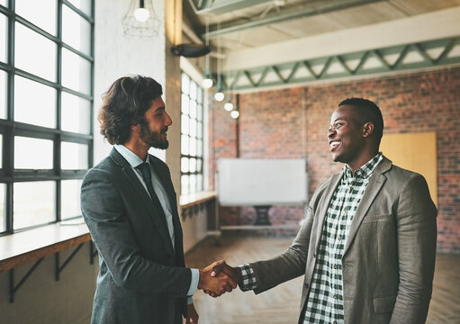 Business people, meeting shaking hands for introduction, welcome or collaboration of startup in corporate real estate. Professional realtor and client success of property and building or office space