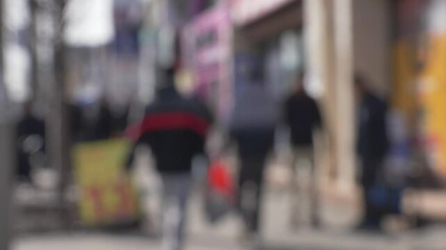busy sidewalk ppl walking in front of local business