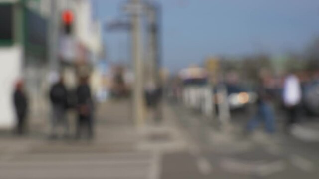 busy local traffic intersection ppl walking crossing street