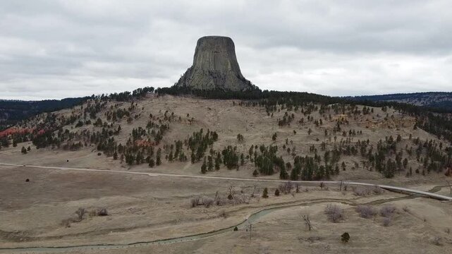 Car Driving by Devils Tower in Wyoming