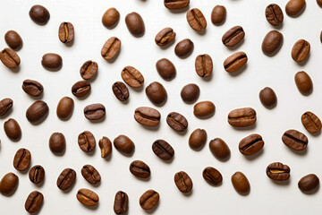 Obraz premium Bunch of coffee beans on white surface with white background.