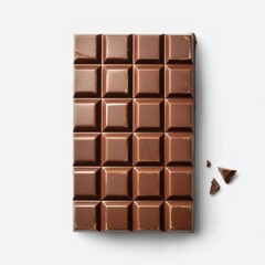 Fototapeta premium A close-up of a milk chocolate bar, featuring a smooth, rich surface and a single broken piece, against a clean white backdrop