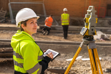 Confident skilled happy smiling professional female site engineer surveyor manager works at...