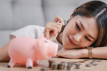 Woman saving money in a piggy bank