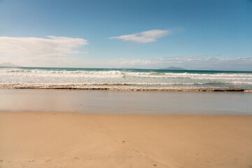 Majestic Waves Crashing on Pristine Beach