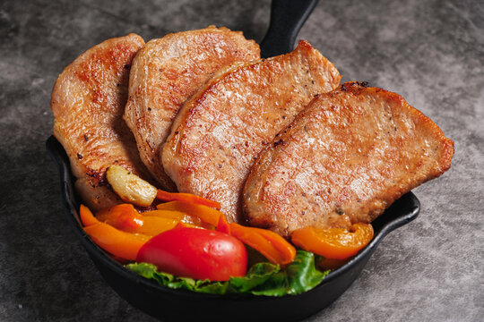 Close-up Pork Sirloin Steak with Fresh salad vegetables