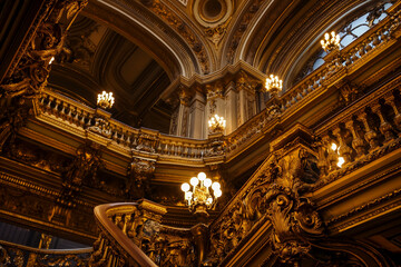 Naklejka premium Ornate interior of a historic building with chandeliers