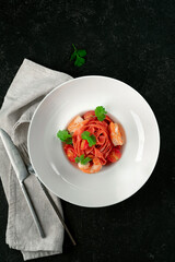 Classic homemade pasta made by hand with colored tagliatelli, ch