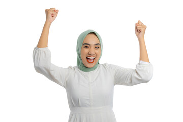 Excited young Asian woman in green hijab and white blouse gesturing yes with raised hand, celebrating victory, success isolated on white background