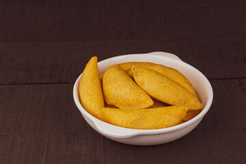 Colombian empanada with spicy sauce 
