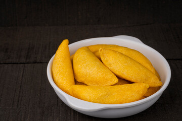 Delicious traditional Colombian empanadas with spicy sauce