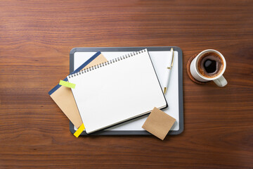 Financial planning blank open page notebook table top still life. Copy space image.