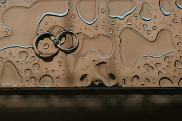 Wedding diamond ring on water background