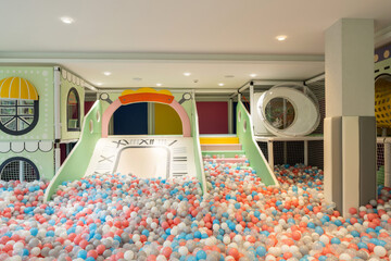 Interior of a kids' playroom full of balls in the hotel