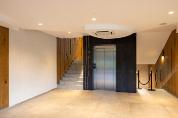 Hotel interior, stairs and elevator door