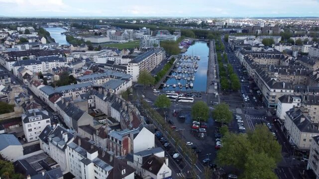 Aerial flying towards marina in city of Caen, France